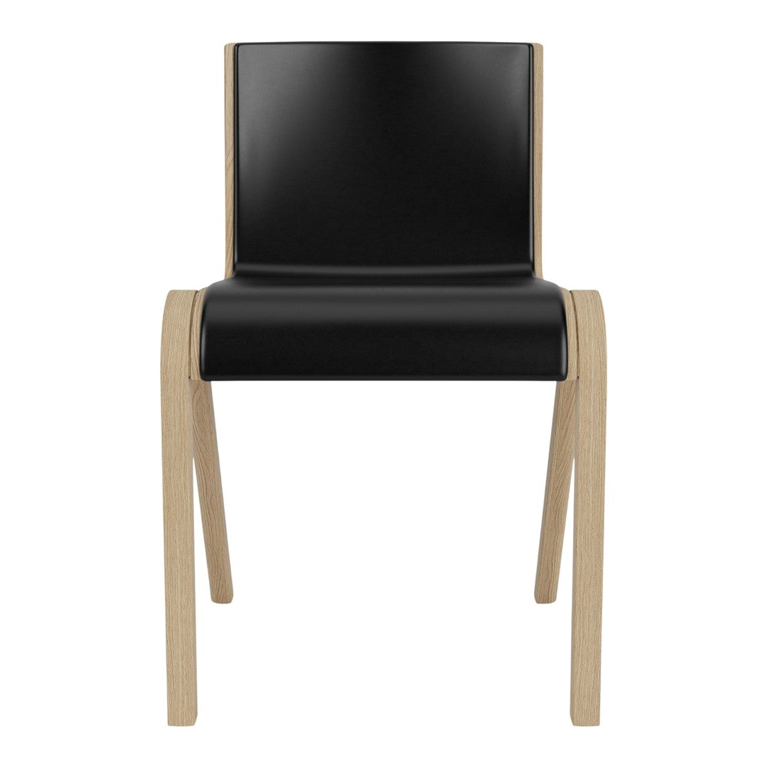 Black and natural wood dining chair with a sleek, modern design and minimalistic pattern. Perfect for contemporary spaces.