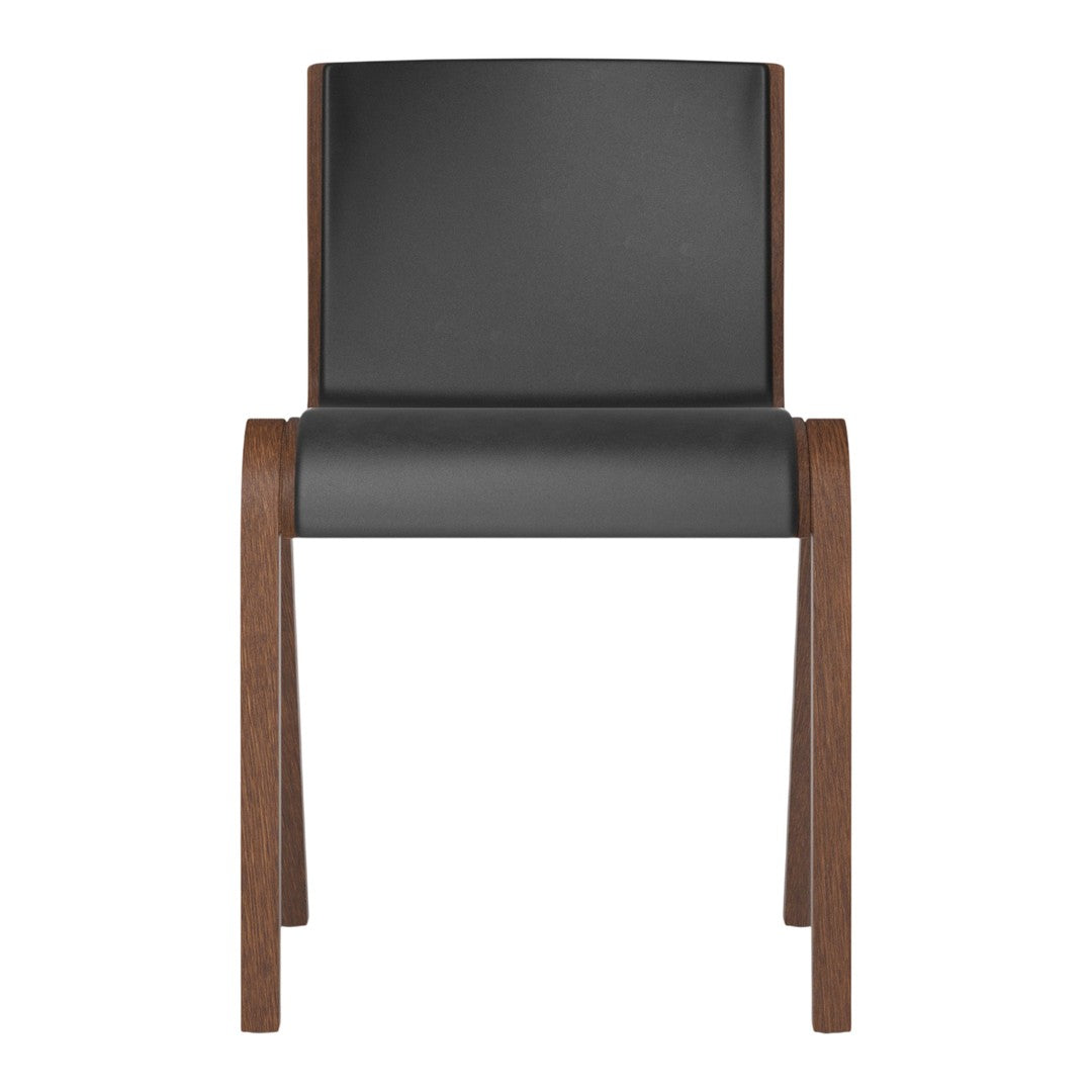Black upholstered chair with a smooth finish and warm wood legs, featuring a minimalist design.