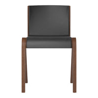 Black upholstered chair with a smooth finish and warm wood legs, featuring a minimalist design.
