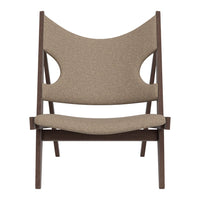 Brown patterned lounge chair with curved backrest and wooden frame, perfect for adding a modern touch to any space.