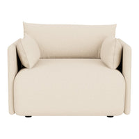 Beige upholstered armchair with two matching cushions and a smooth, modern design. Perfect for any stylish living space.