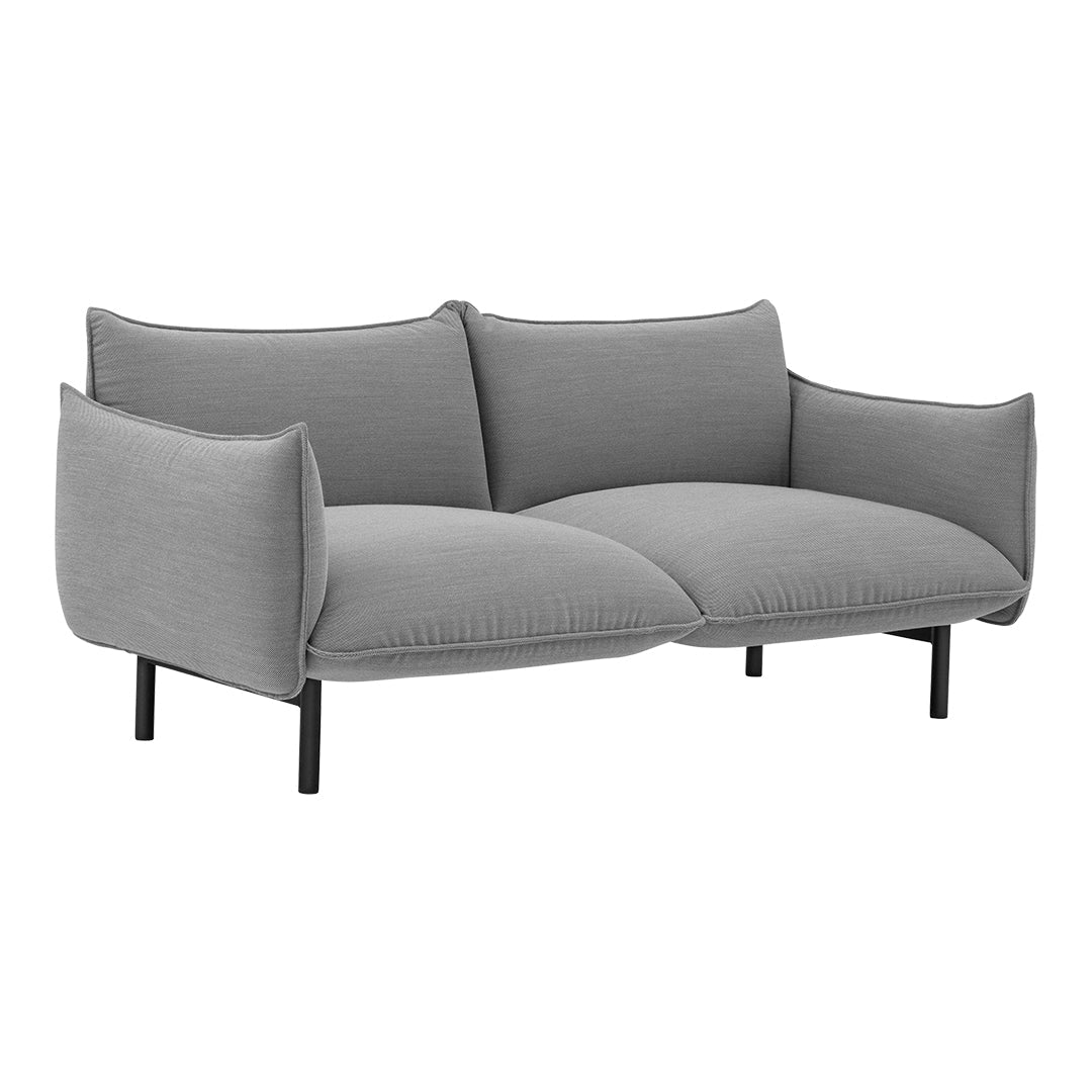 Grey upholstered sofa with a smooth texture and modern, minimalist design featuring rounded arms and sleek black legs.