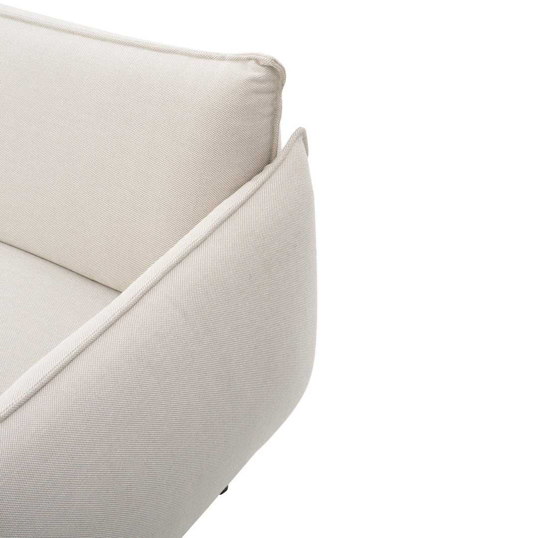Beige fabric sofa with clean lines and a textured finish, perfect for contemporary decor.