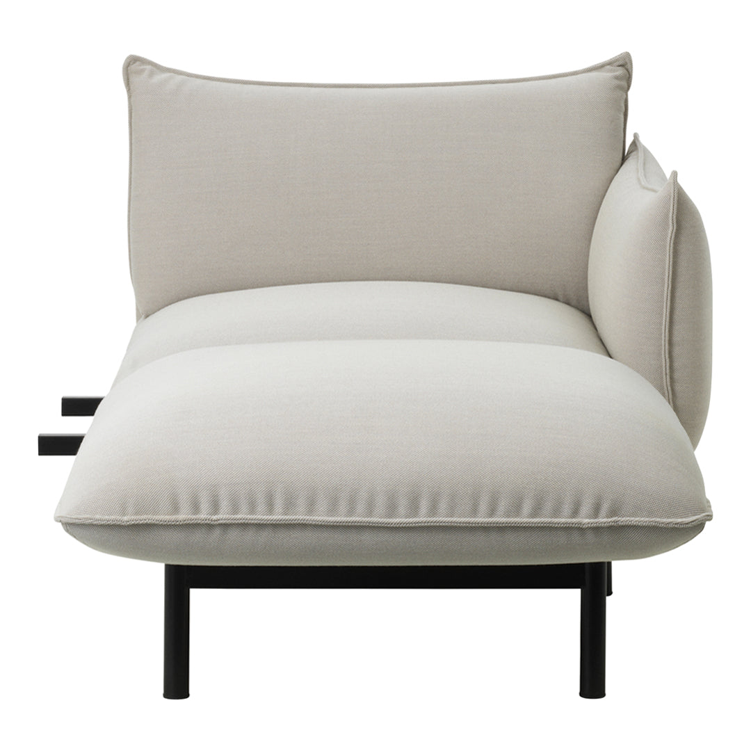 Light beige cushion with a smooth texture, featuring minimalistic design and black metal frame accents.