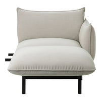 Light beige cushion with a smooth texture, featuring minimalistic design and black metal frame accents.