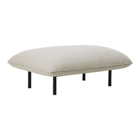 Light beige cushion with a smooth texture, supported by sleek black metal legs, minimalistic and modern design.