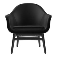 Black leather chair with a sleek, minimalist design and smooth curves, sitting on a contrasting black wooden frame.