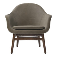 Sleek olive green chair with a smooth texture and wooden legs, perfect for modern interiors.