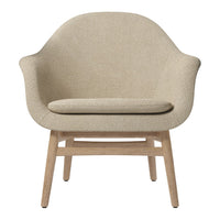 Beige upholstered chair with a textured finish and natural wood legs, offering a minimalist, modern design.