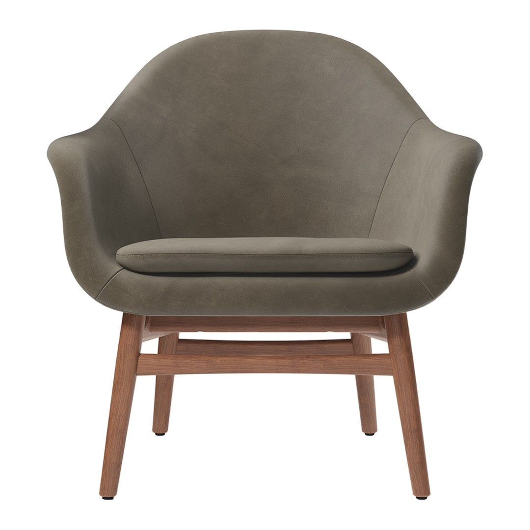 Olive green upholstered chair with a smooth texture and wooden legs, featuring a modern, minimalist design.