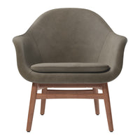 Olive green upholstered chair with a smooth texture and wooden legs, featuring a modern, minimalist design.