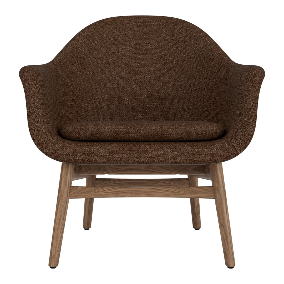 Brown upholstered chair with a smooth, rounded design and natural wooden legs. Ideal for modern interiors.