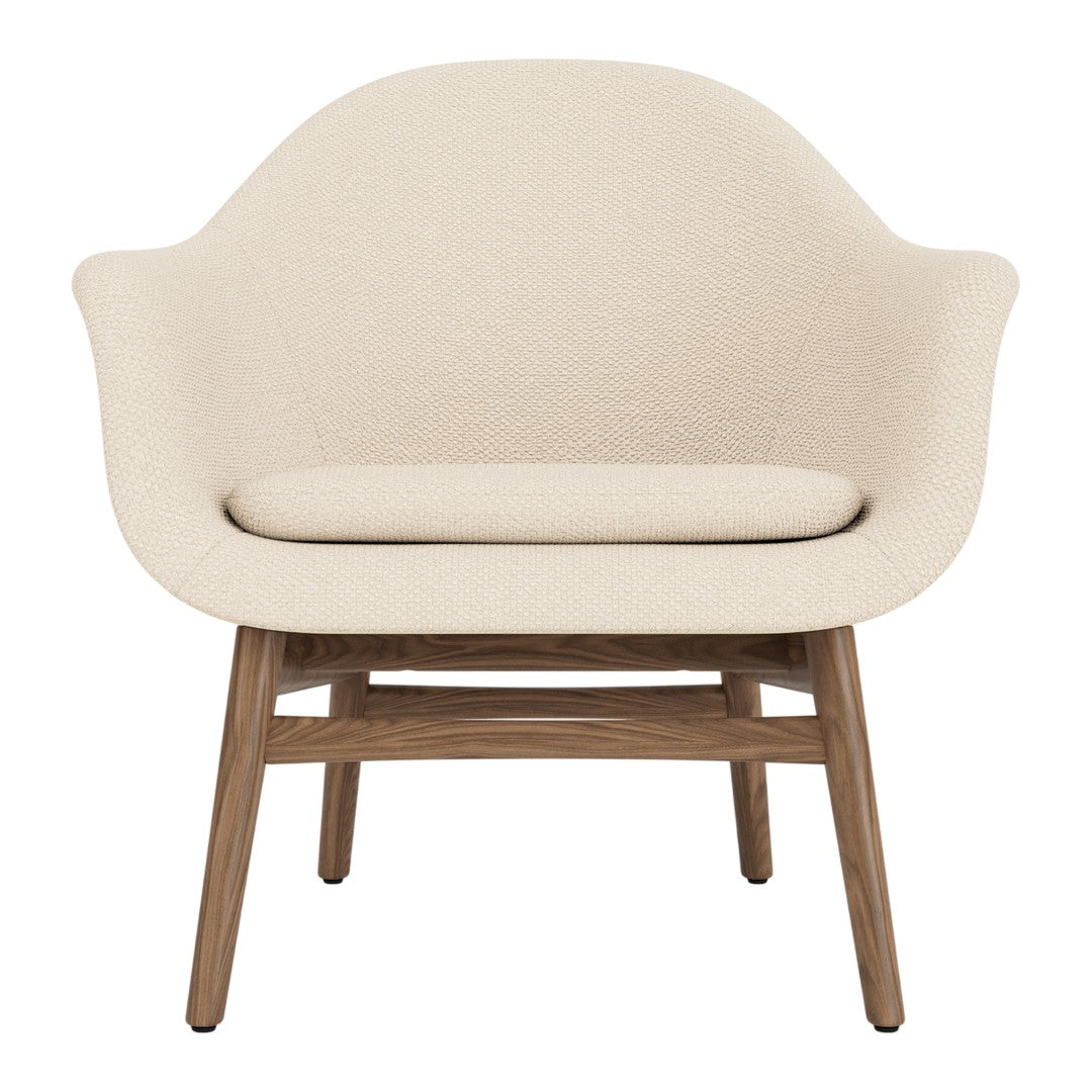Light beige armchair with smooth upholstery and natural wood legs, offering a minimalist design and neutral color palette.