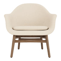 Light beige armchair with smooth upholstery and natural wood legs, offering a minimalist design and neutral color palette.