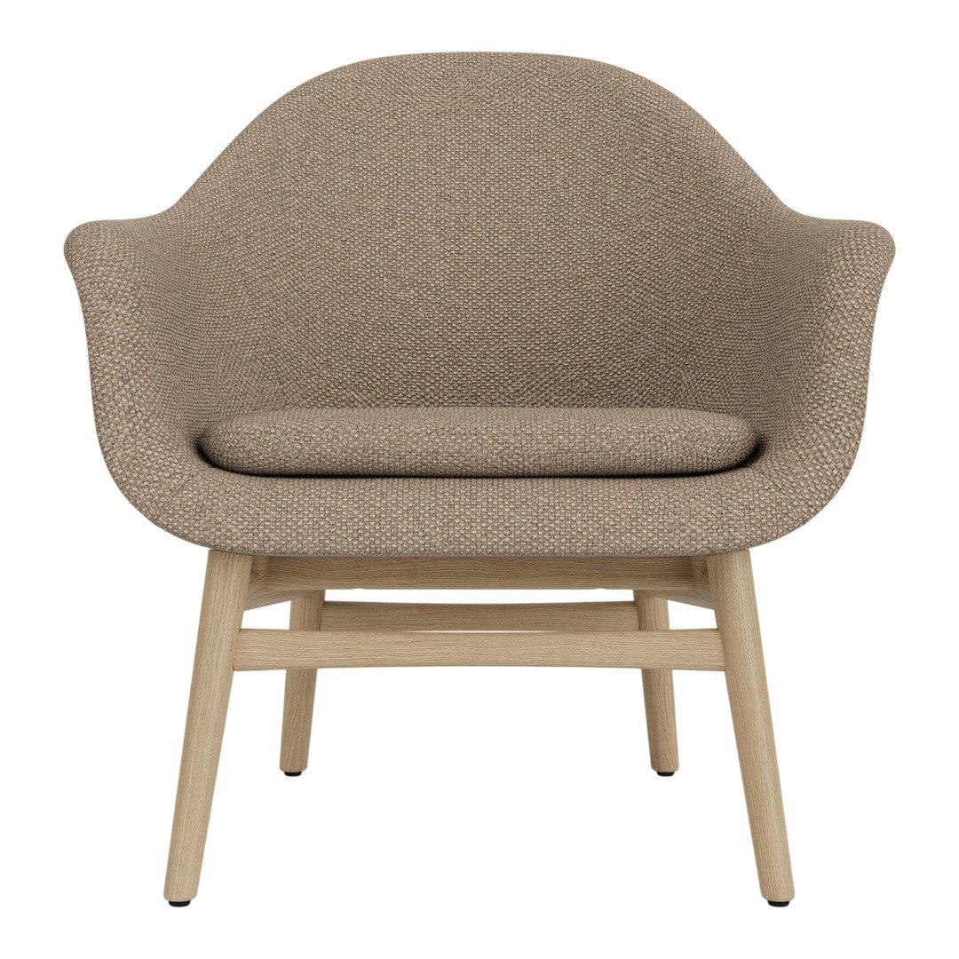 Cozy beige upholstered chair with a textured finish and light wooden legs, ideal for modern interiors.