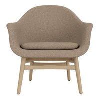 Cozy beige upholstered chair with a textured finish and light wooden legs, ideal for modern interiors.
