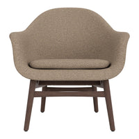 Brown textured armchair with a smooth, rounded design and dark wooden legs, perfect for modern decor.