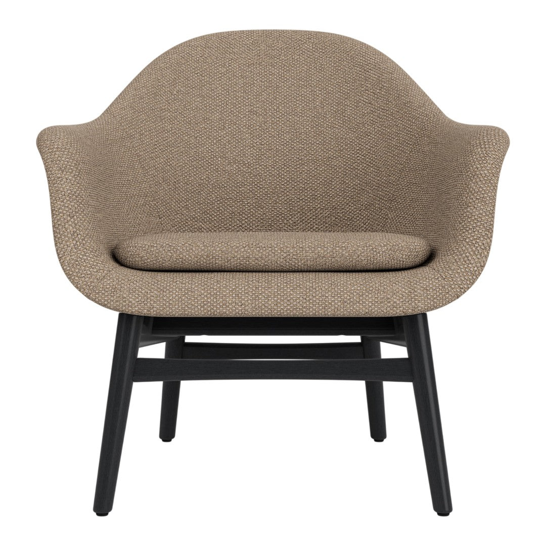 Brown textured fabric armchair with a smooth, rounded design and a sleek black wooden base. Perfect for modern decor.