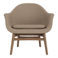 Beige upholstered chair with a smooth texture and natural wood legs, perfect for modern interior decor.