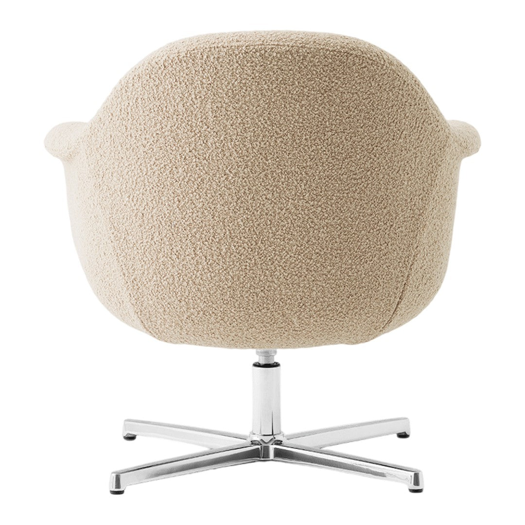Beige textured upholstery armchair with a sleek chrome base, perfect for modern interiors.