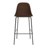 Brown upholstered bar stool with sleek black metal legs, perfect for modern decor.