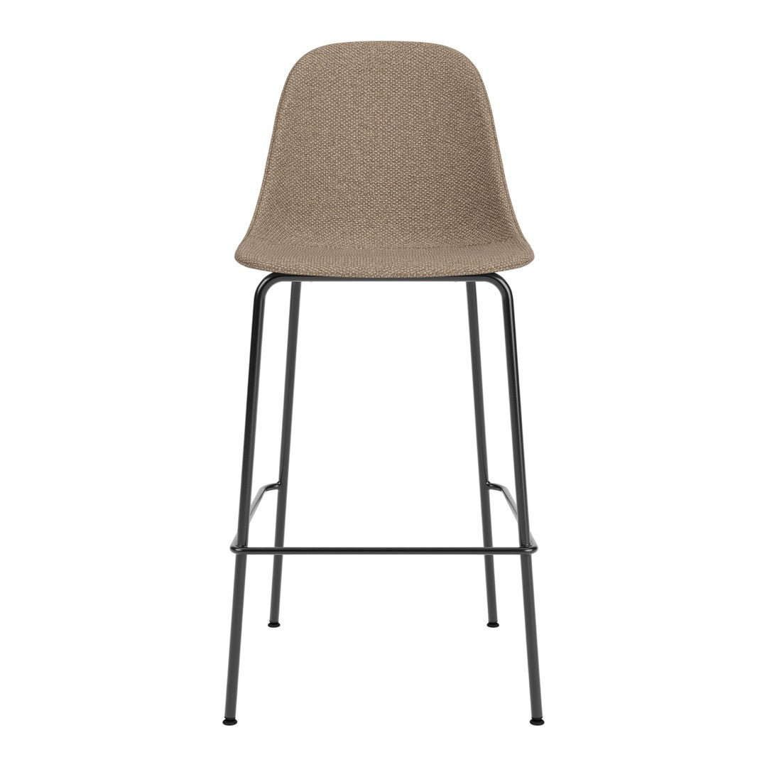 Tan woven chair with smooth curves and a black metal frame, featuring a minimalist design. Perfect for modern decor.