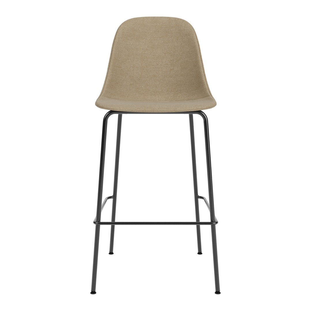 Neutral beige bar stool with a smooth, solid seat and sleek black metal legs. Modern, minimalist design.