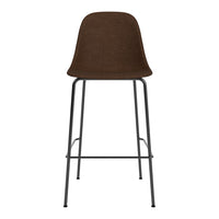 Brown upholstered bar stool with a sleek black metal frame, featuring a modern, minimalist design.
