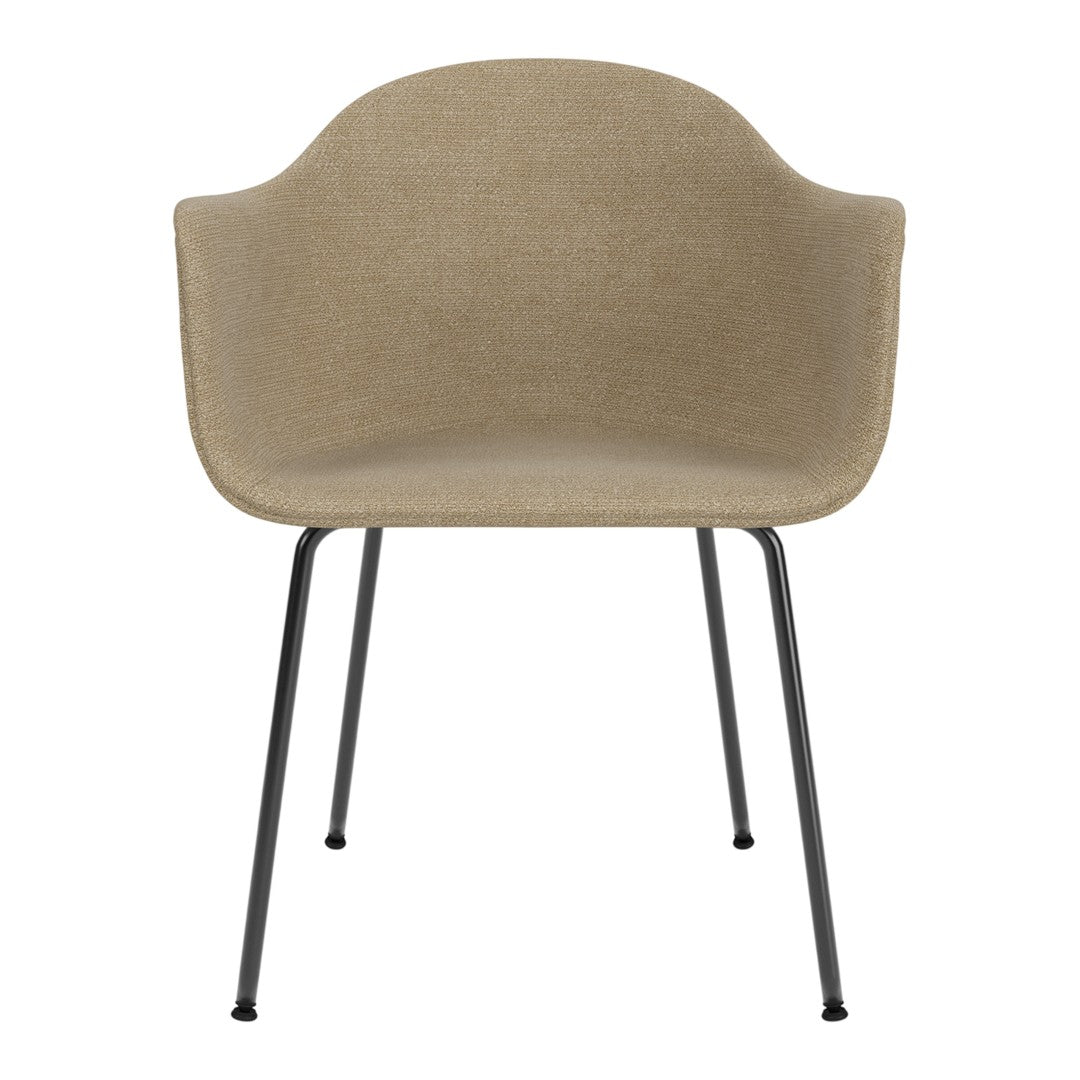 Beige upholstered chair with smooth texture, featuring sleek black metal legs for a modern look.