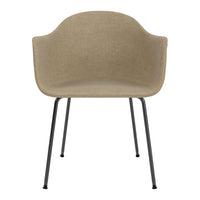 Beige upholstered chair with smooth texture, featuring sleek black metal legs for a modern look.