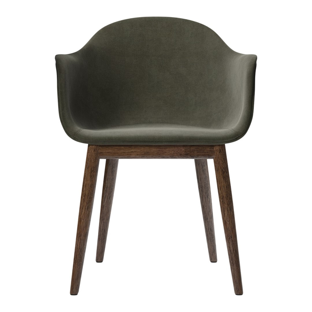 Olive green upholstered chair with a sleek design and dark brown wooden legs. Modern and stylish home decor piece.