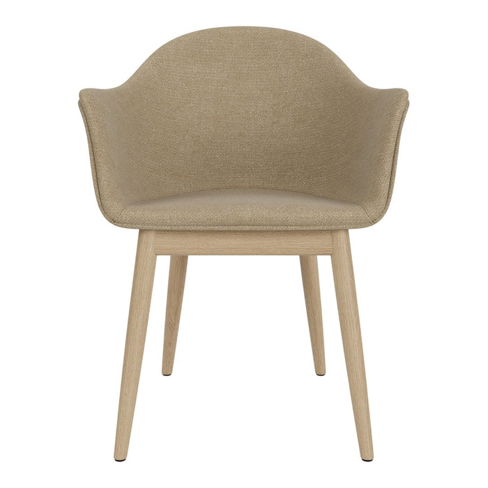 Beige upholstered chair with smooth curves and light wooden legs, featuring a minimalist design for modern interiors.