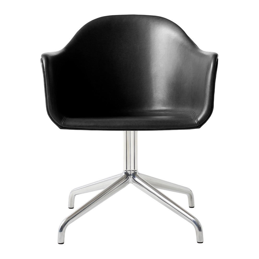 Black modern chair with a smooth finish and a sleek, shiny silver base. Minimalist design for contemporary decor.