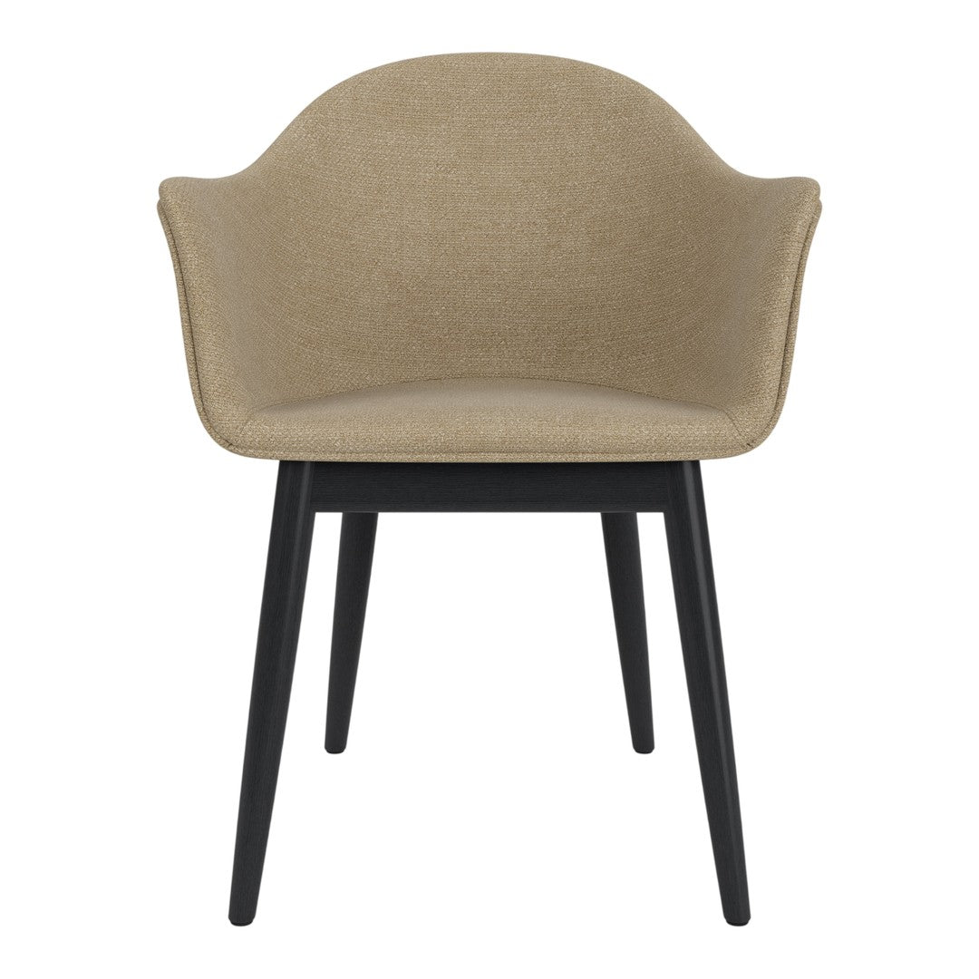 Beige fabric chair with a smooth surface and black wooden legs, offering a modern and minimalist design.