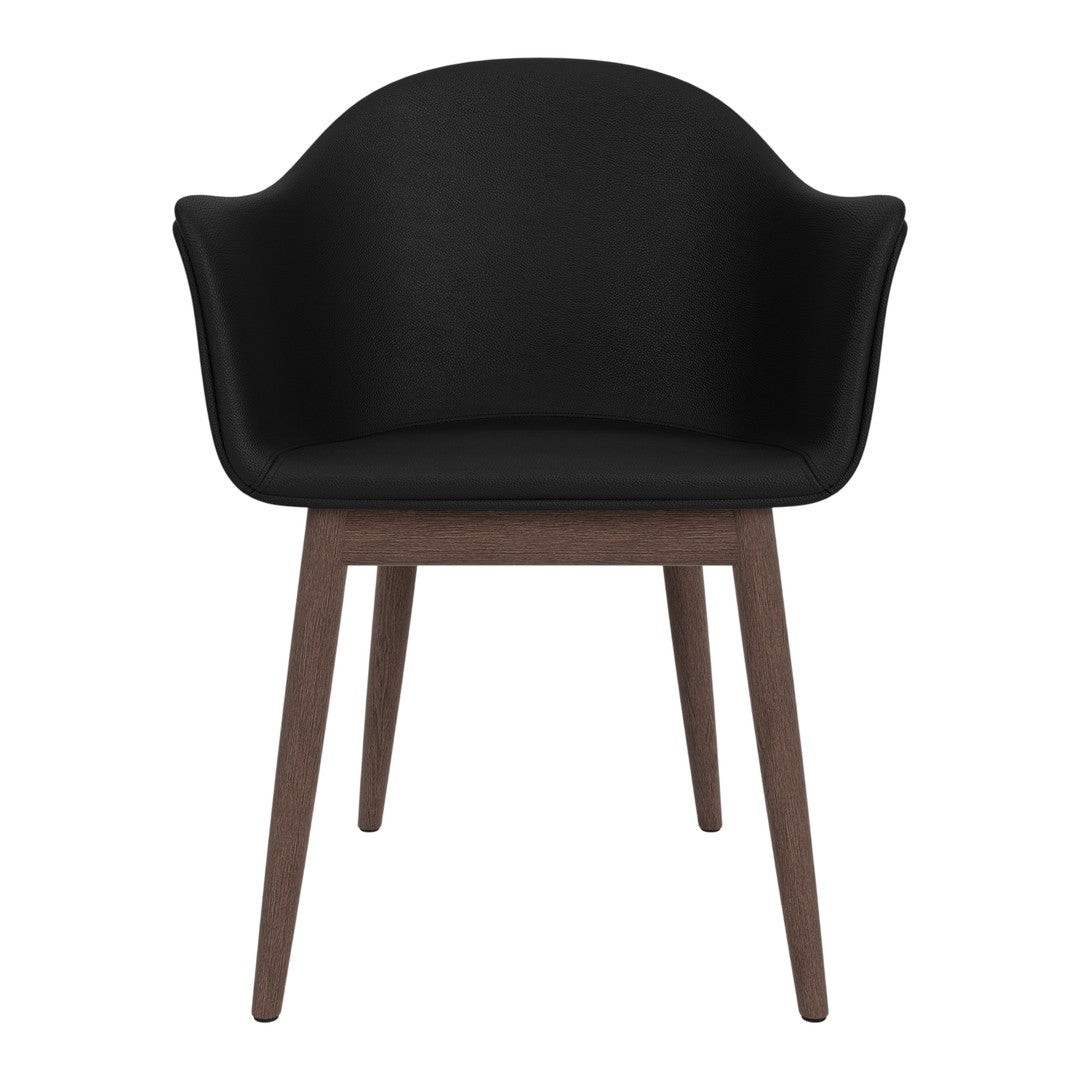 Black upholstered chair with a smooth finish and wooden legs, blending modern and minimalist design elements.