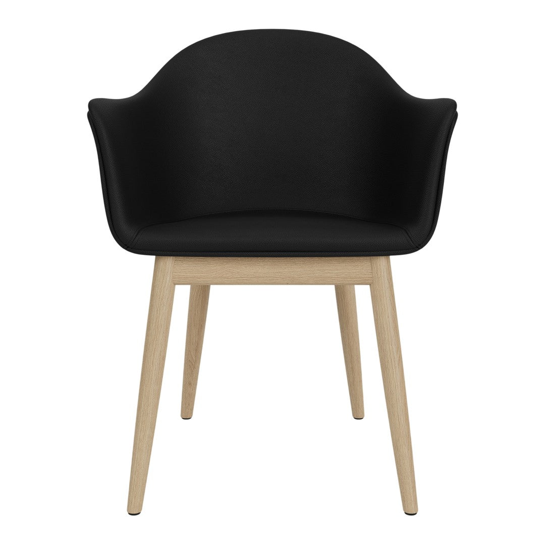 Modern black chair with curved back and natural wooden legs, stylish and comfortable design. Perfect for any decor.