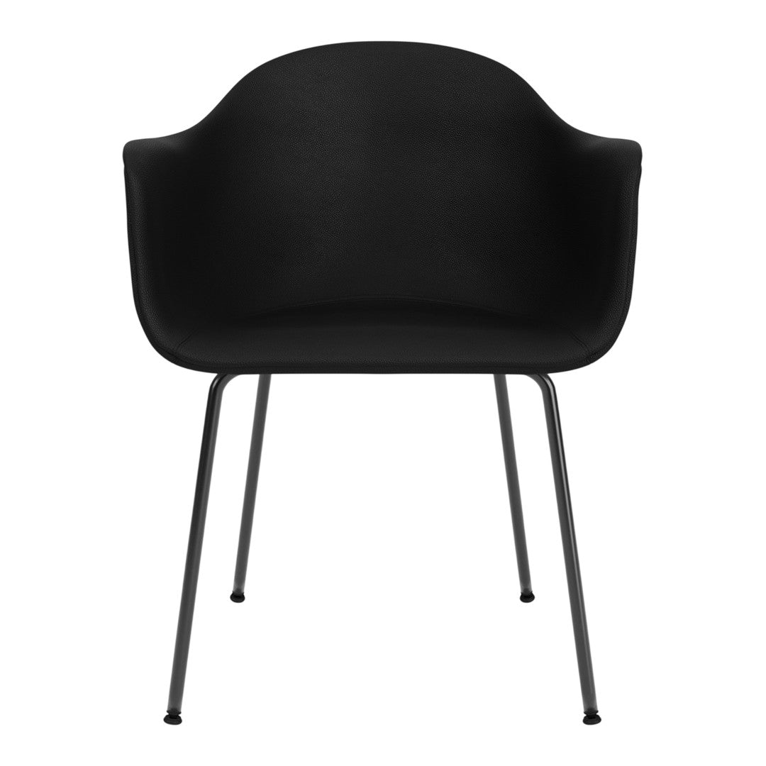 Modern black chair with sleek lines and textured fabric, supported by minimalist metal legs. Perfect for contemporary spaces.
