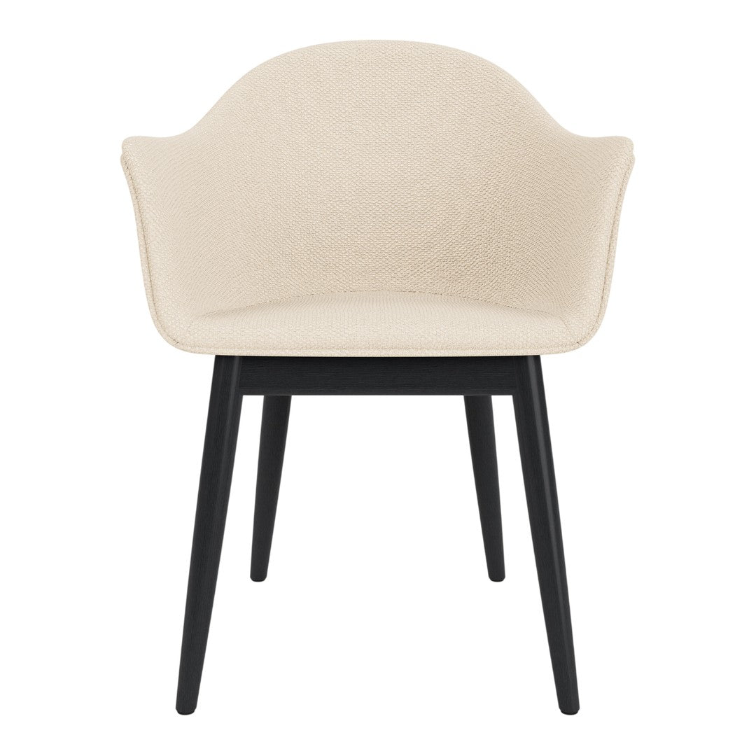 Beige upholstered chair with black wooden legs, featuring a sleek, minimalist design. Perfect for modern decor.