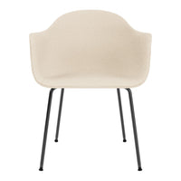 Beige upholstered chair with a minimalist design and black metal legs, perfect for modern interiors.
