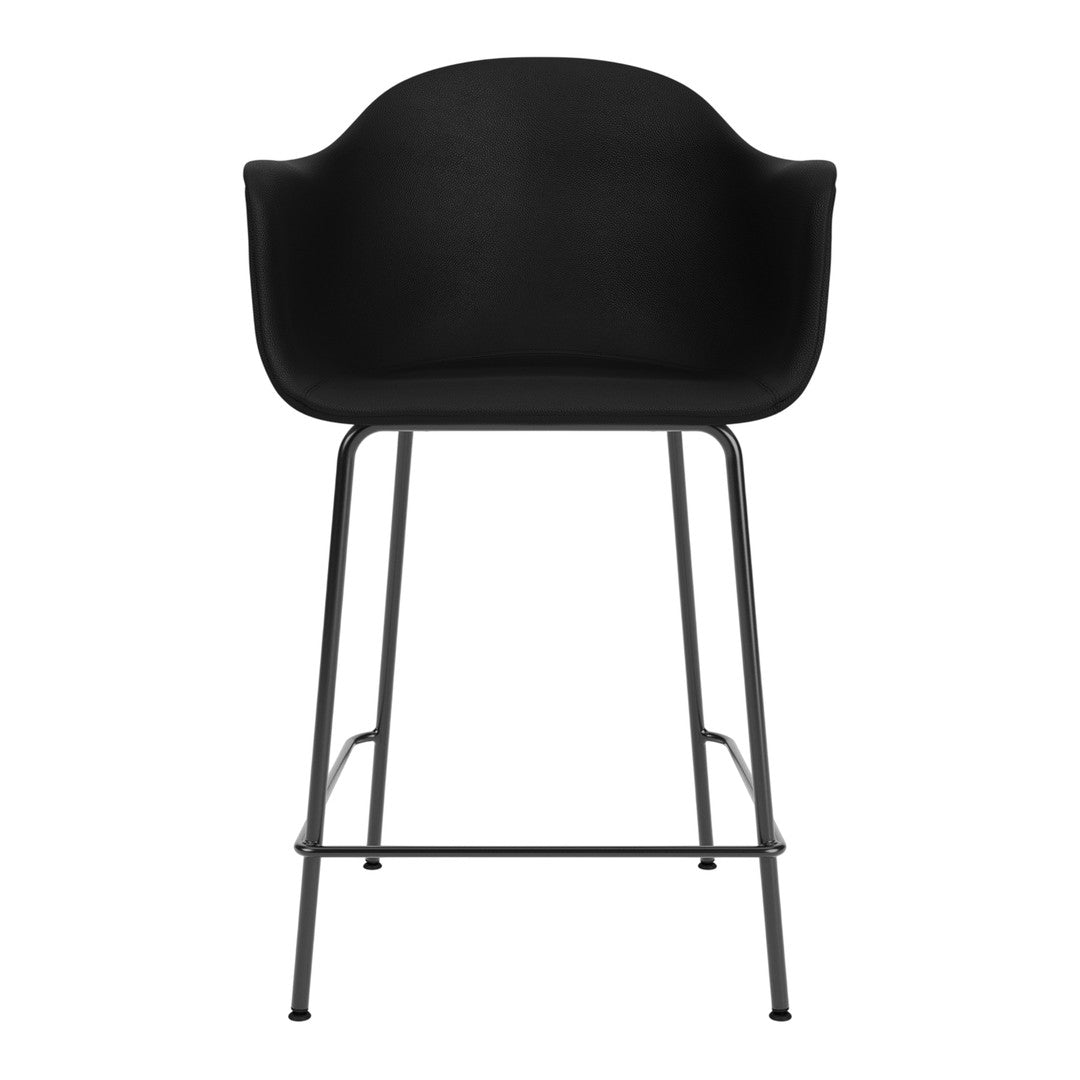Black bar stool with a smooth, rounded seat and minimalist metal legs, perfect for modern decor.