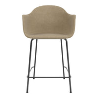 Beige upholstered bar stool with a modern design and sleek black metal legs. Ideal for contemporary decor.