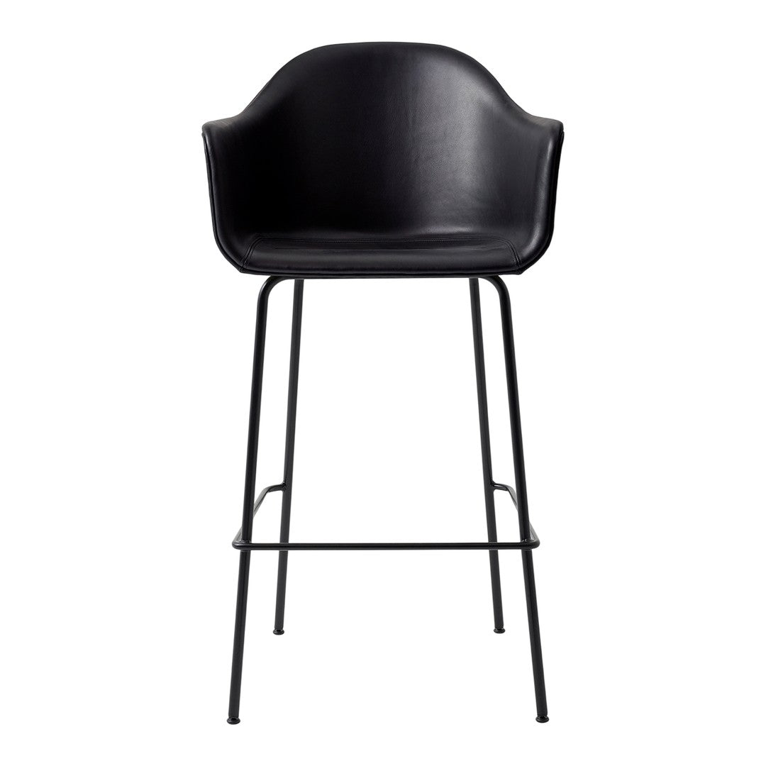 Black upholstered bar stool with a sleek black metal frame, featuring a minimalist and modern design.