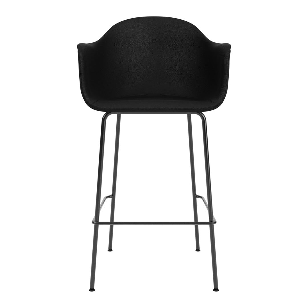 Black modern bar stool with a matte finish and sleek metal legs, featuring a minimalist design.