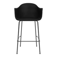 Black modern bar stool with a matte finish and sleek metal legs, featuring a minimalist design.