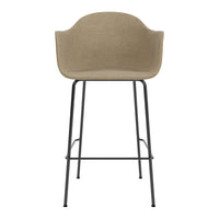 Beige upholstered bar stool with a modern black metal frame and smooth, minimalist design. Perfect for contemporary decor.
