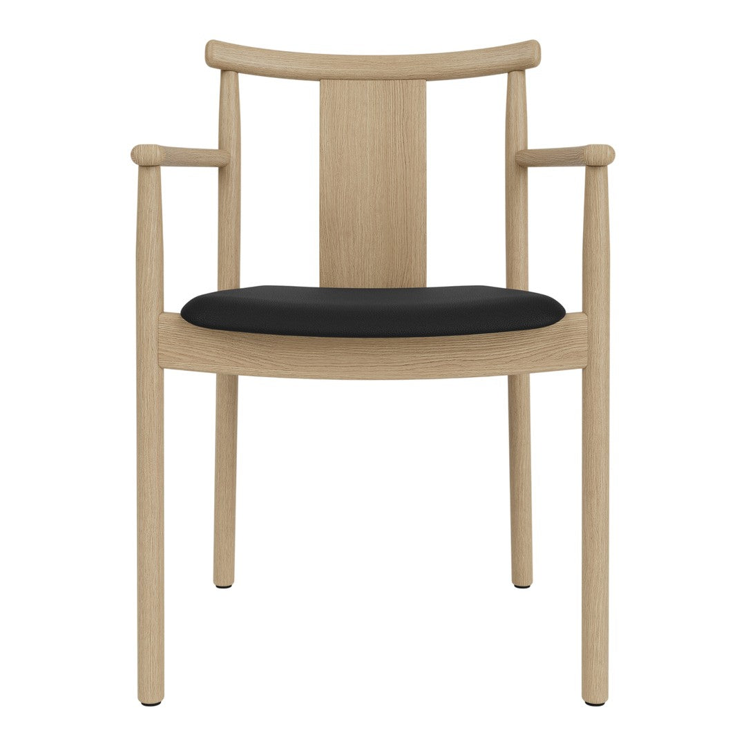 Light wood chair with a smooth finish and a contrasting black cushioned seat. Modern, minimalist design.