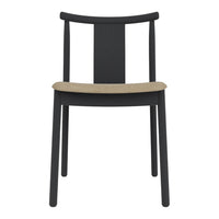 Black wooden chair with a sleek design and a natural-colored, woven seat. Modern and minimalist style.