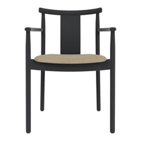 Black wooden chair with a sleek design and a natural beige seat cushion. Elegant, minimalist aesthetic.