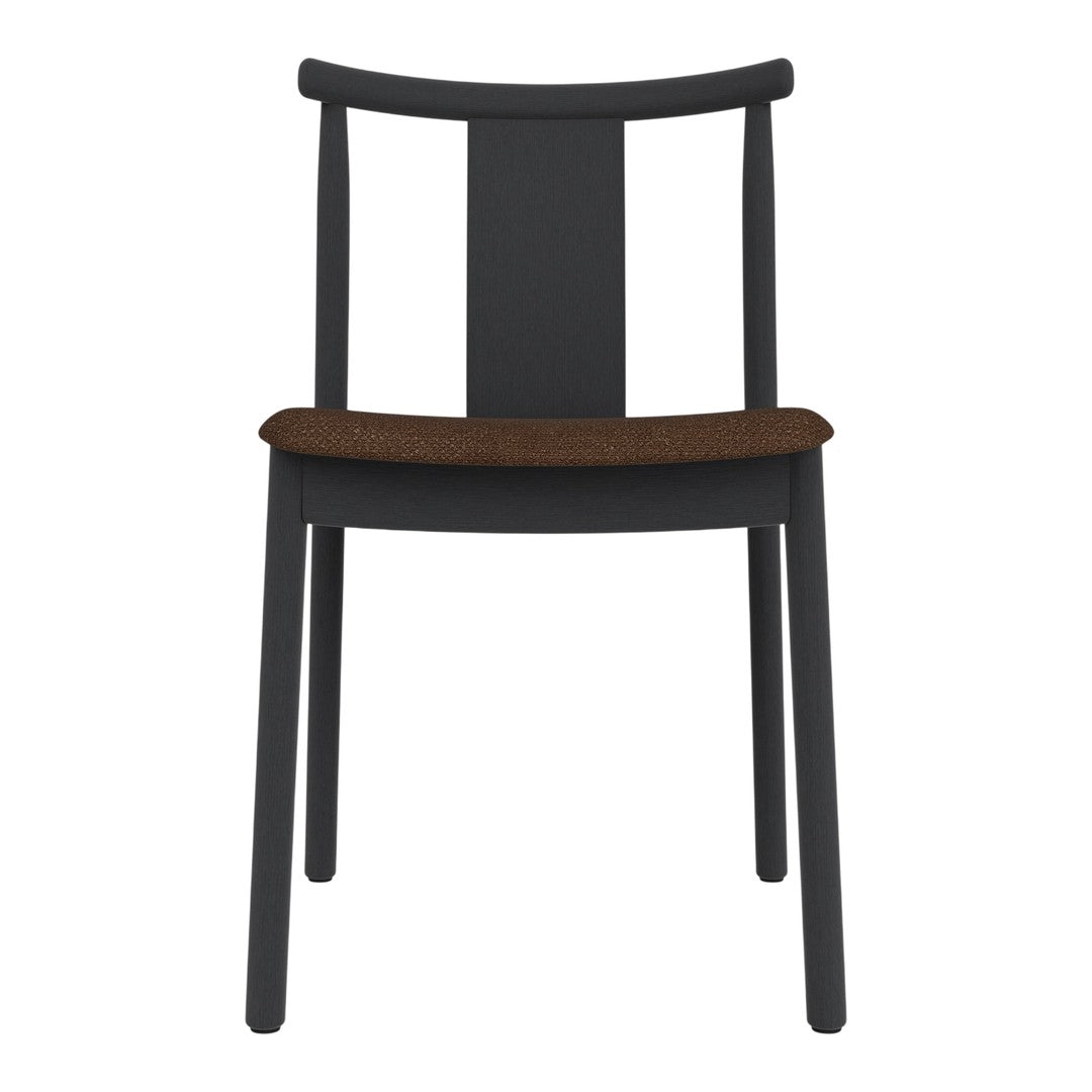 Black wooden chair with a simple design and a warm brown cushion seat. Minimalist style, no patterns.