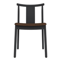 Black wooden chair with a simple design and a warm brown cushion seat. Minimalist style, no patterns.